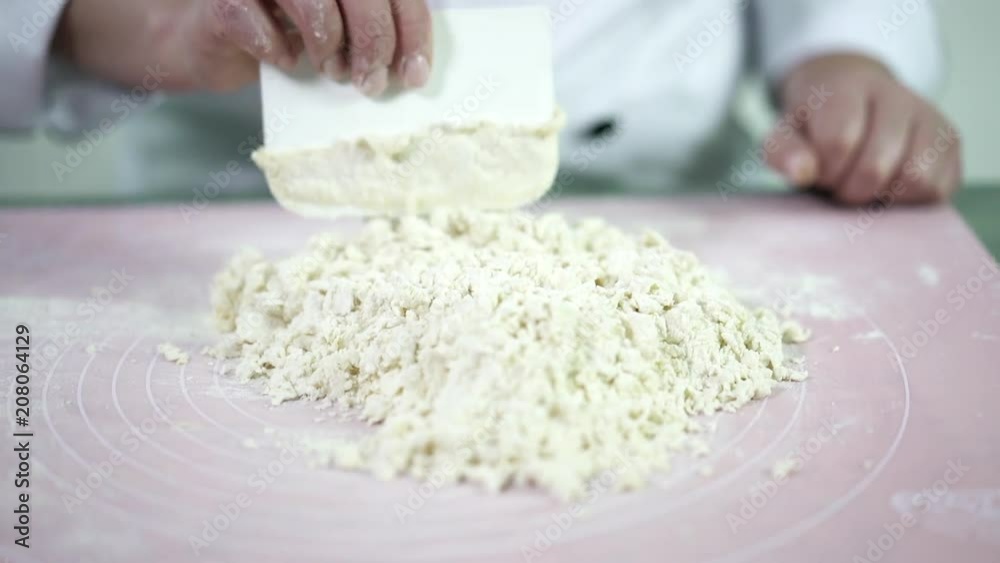Bakery process at home. Modern devices for preparing dough consisted of an egg yolk and wheat flour. Simple recipe for delicious cake Bakery process at home. Modern devices for preparing dough consisted of an egg yolk and wheat flour. Simple recipe for delicious cake
