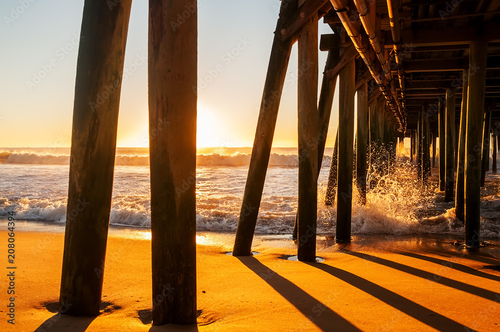 Dawn on the Atlantic coast. Waves crashing against an old wooden pier. USA. Maine
Dawn on the Atlantic coast. Waves crashing against an old wooden pier. USA. Maine