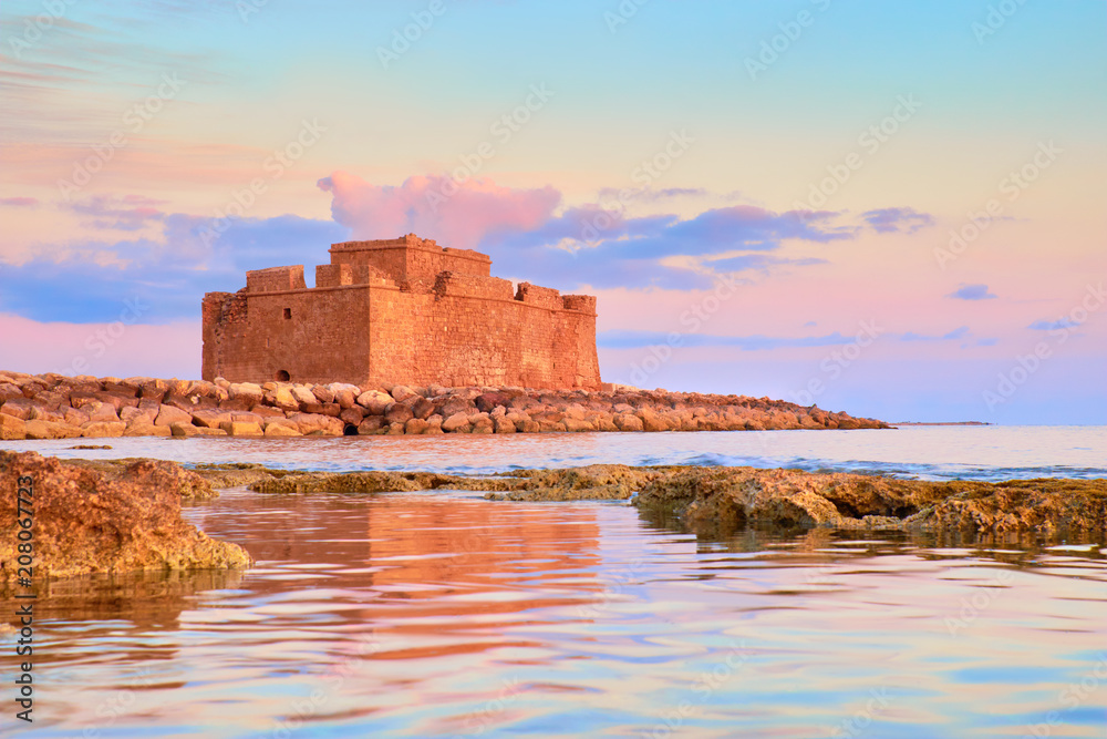 Pafos Harbour Castle in Pathos, Cyprus, on a sunset