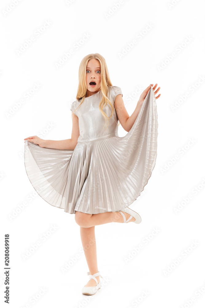 Full length image of Shocked young blonde girl in dress Full length image of Shocked young blonde girl in dress
