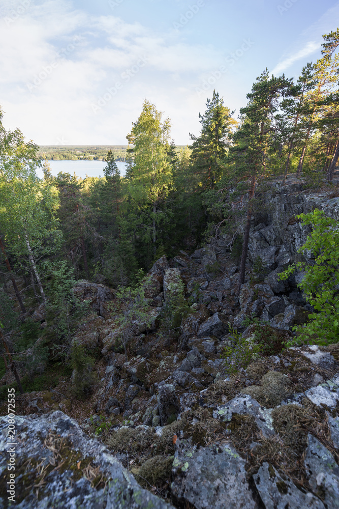 Lake, lush forest, rocky hill and cliff viewed from the Pirunvuori ( Lake, lush forest, rocky hill and cliff viewed from the Pirunvuori (