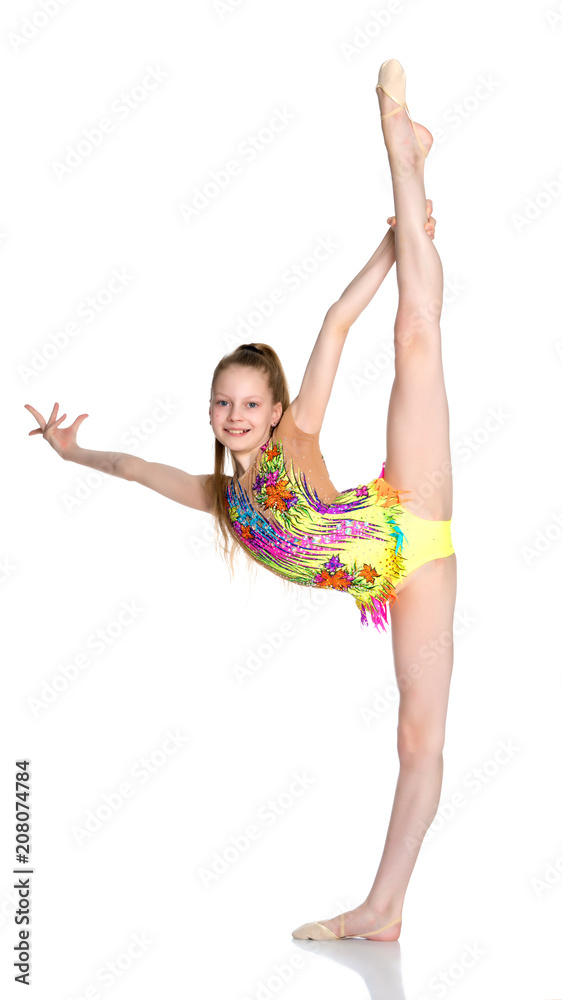 Fototapeta premium The gymnast balances on one leg.