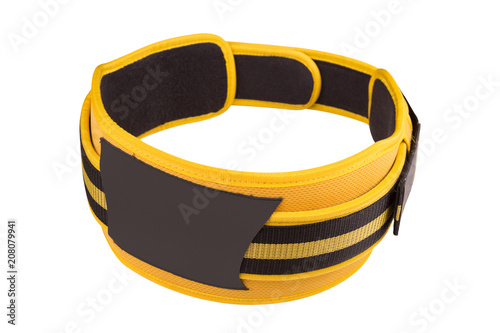 yellow wide belt for weight lifting and powerlifting, buttoned, isolated on white background isolated photo