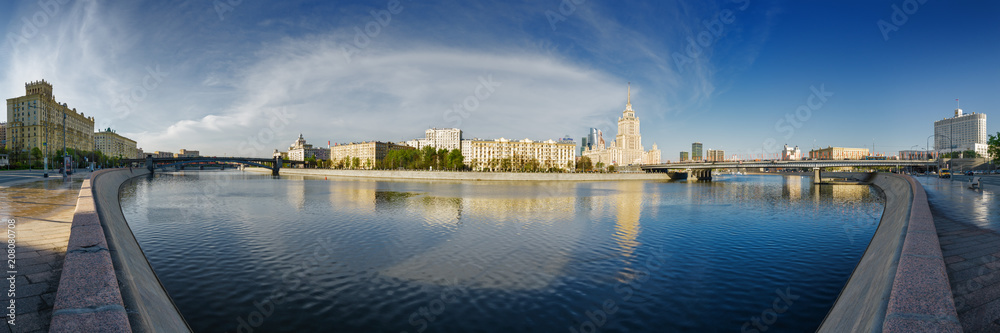 Sunny morning view of Smolenskaya embankment and Moskva river, Moscow, Russia.