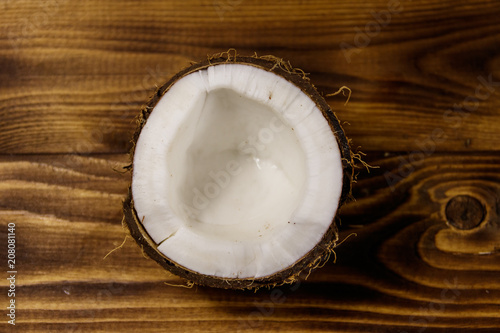 Fresh ripe coconut on rustic wooden table