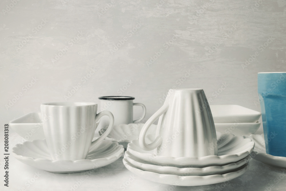 White ceramic coffee cups in old kitchen, grunge background White ceramic coffee cups in old kitchen, grunge background
