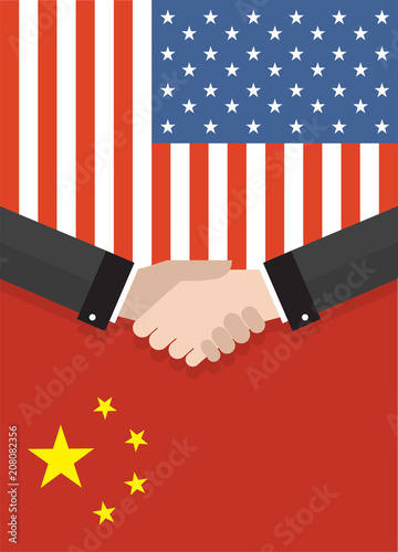 Two businesspeople handshake after good deal in front of an american and chinese flag. two flags face to face, symbol for the relationship between the two countries.
