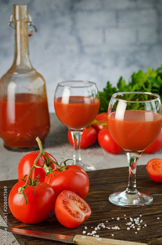 Tomato Juice and Fresh Tomatoes isolated on a White Background Tomato Juice and Fresh Tomatoes isolated on a White Background