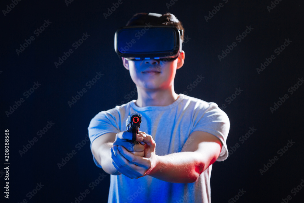 Modern firearm. Selective focus of a handgun being directed at you Modern firearm. Selective focus of a handgun being directed at you