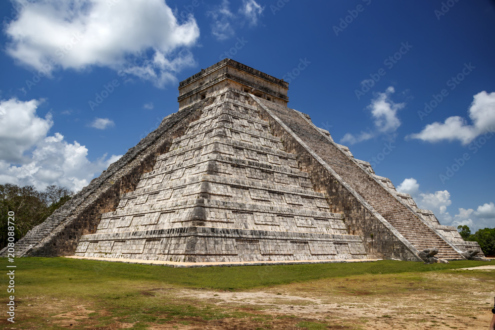 Two walls restored and no of the pyramid with the god of the feathered serpent mayan kukulkan quetzalcoatl. Chichen Itza. Mexico