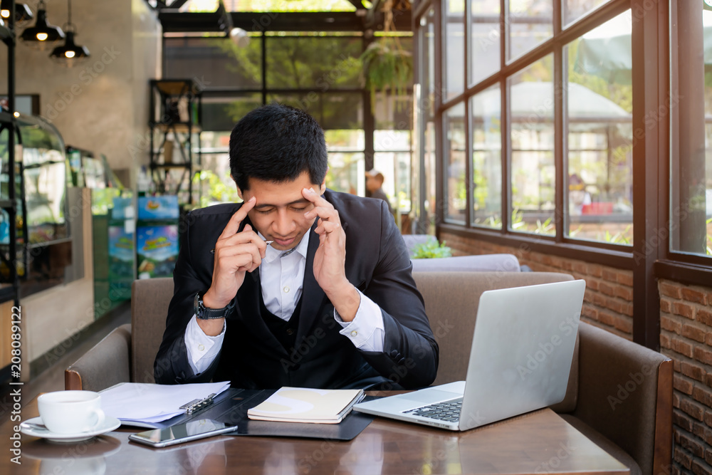Business man working at office with laptop and documents on his desk, consultant lawyer concept Business man working at office with laptop and documents on his desk, consultant lawyer concept