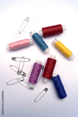 multi-colored thread coils and pins