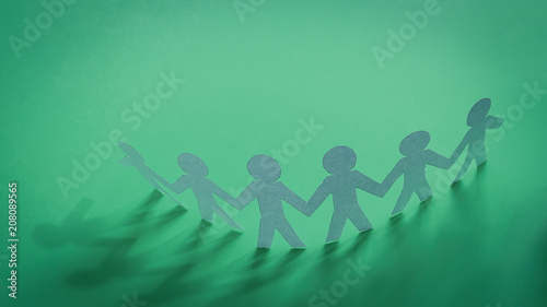 group paper man on a green background