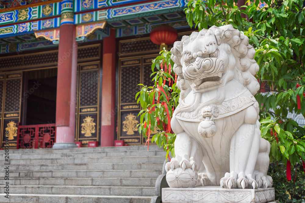 Lion white stone sculpture in a buddhist temple in Chengdu, China Lion white stone sculpture in a buddhist temple in Chengdu, China