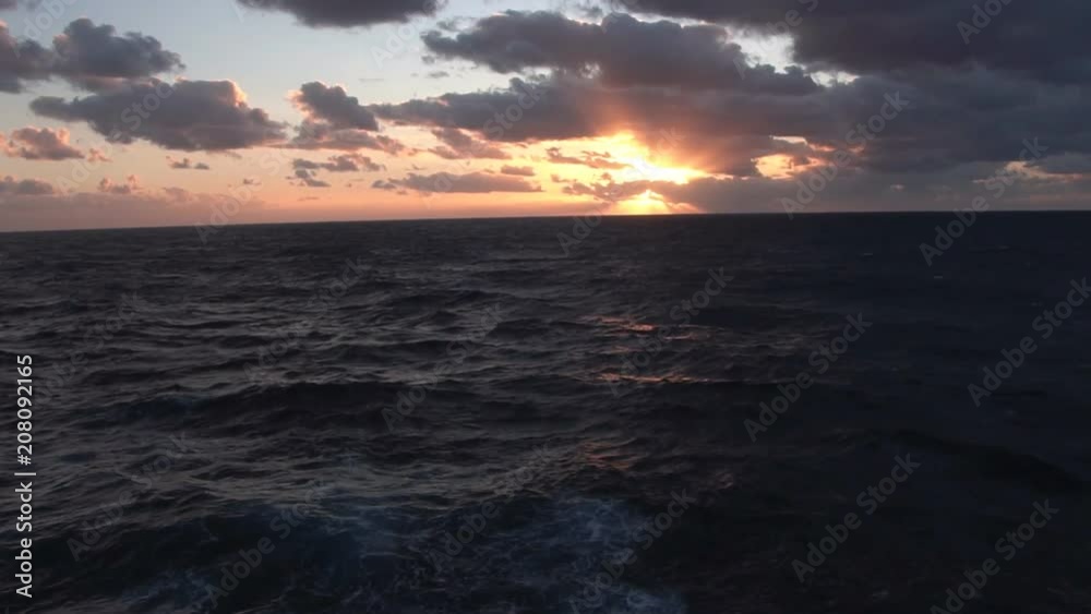 Cloudy sunset in the open sea. Cloudy sunset in the open sea.