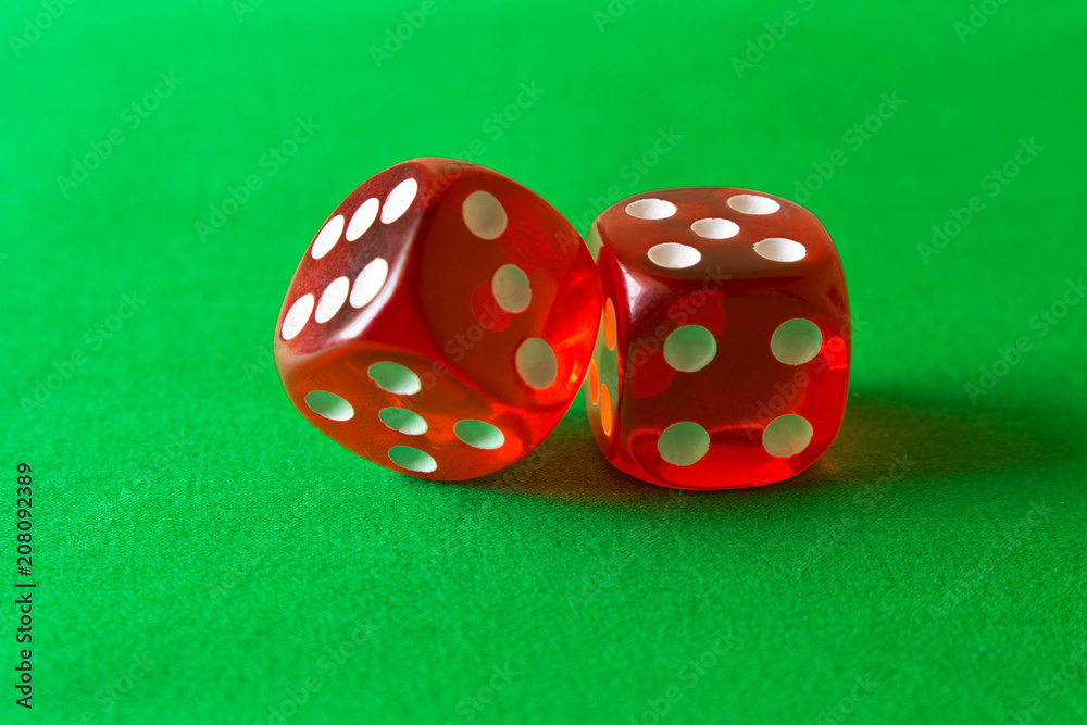 Dice on a green background . Game concept. Games of chance Dice on a green background . Game concept. Games of chance