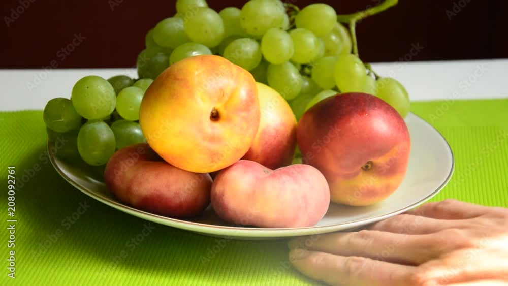 Plate full of fruit, and vitamins beside. Chooseing natural vitamins instead of synthetich one. Healt. Plate full of fruit, and vitamins beside. Chooseing natural vitamins instead of synthetich one. Healt.
