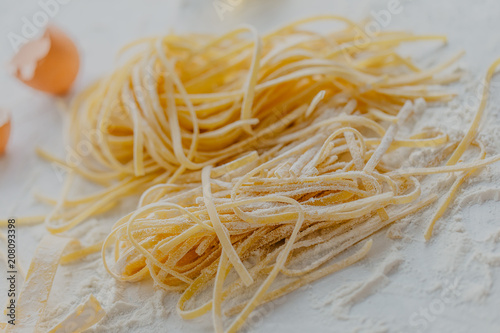 Raw classic traditional italian pasta on table