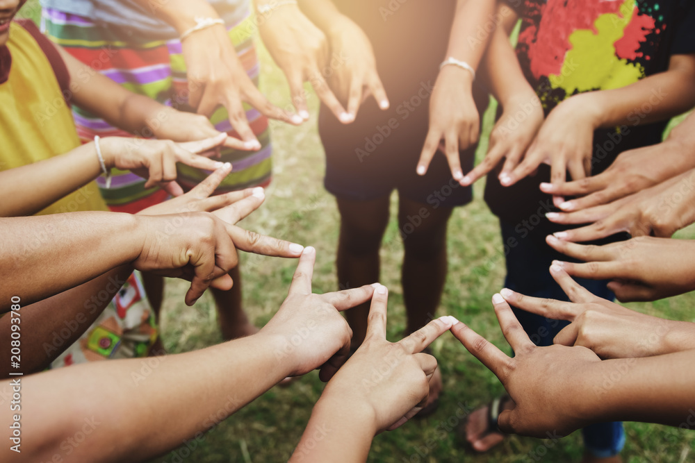 Fototapeta premium finger of group circle of children at playground. concept teamwork