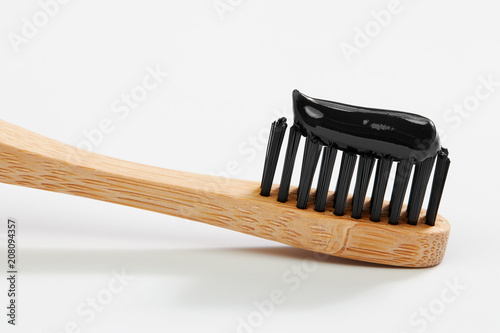 Fototapeta Naklejka Na Ścianę i Meble -  Toothbrush with black charcoal toothpaste