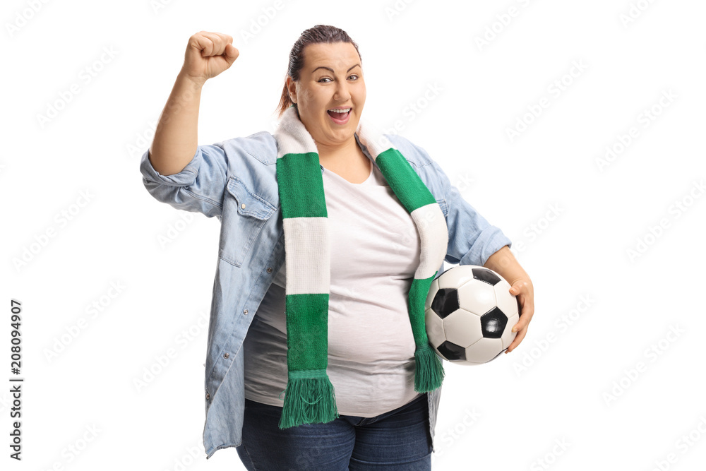 Joyful female soccer fan with a scarf and a football gesturing with her hand