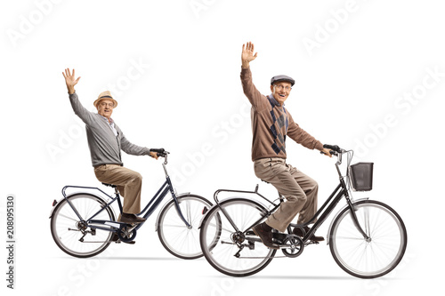 Seniors riding bicycles and waving at the camera
