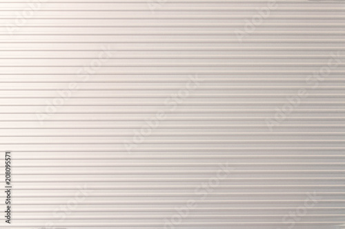 Texture of metallic silver striped briefcase . Silver background