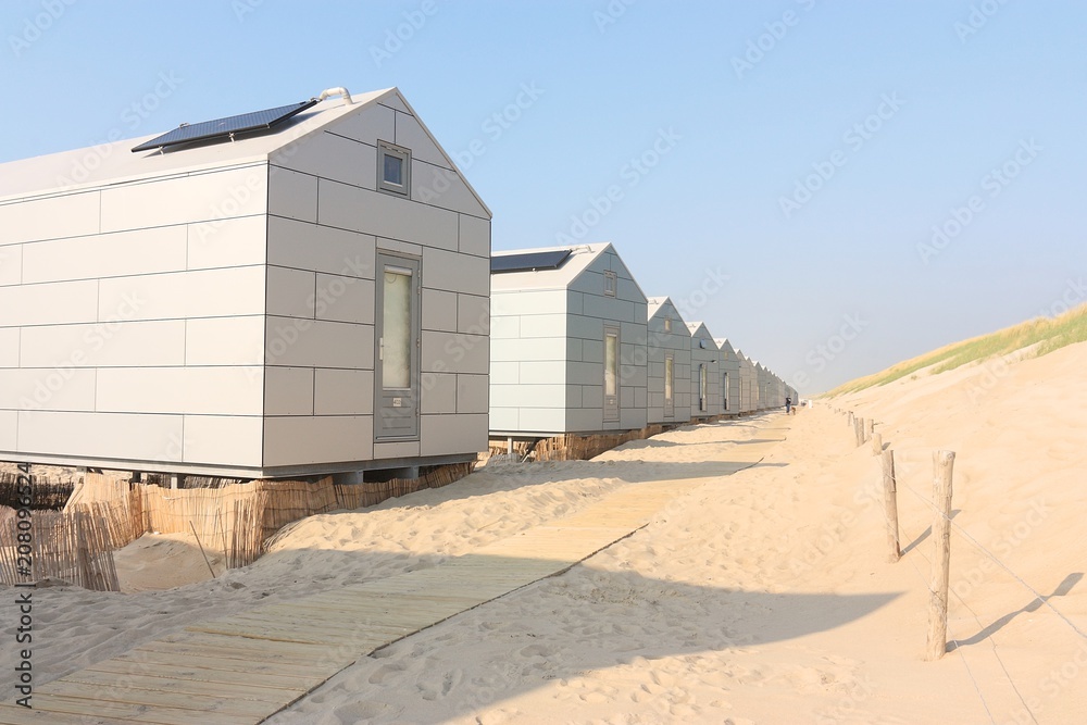Naklejka premium White beach houses along the North Sea coast, Netherlands