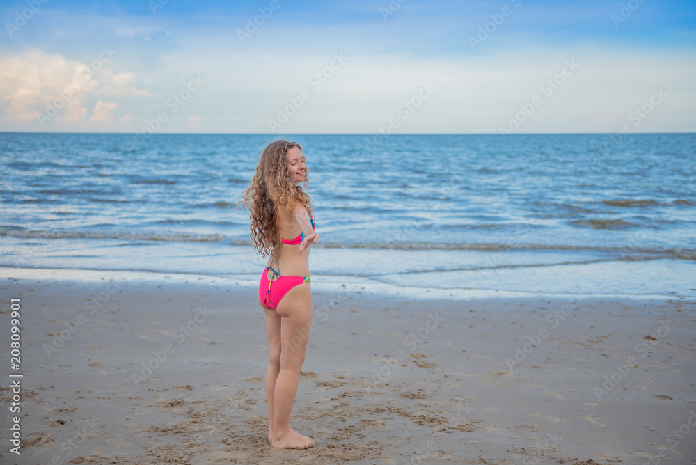 Young yoga healthy woman workout on the beach. Young yoga healthy woman workout on the beach.