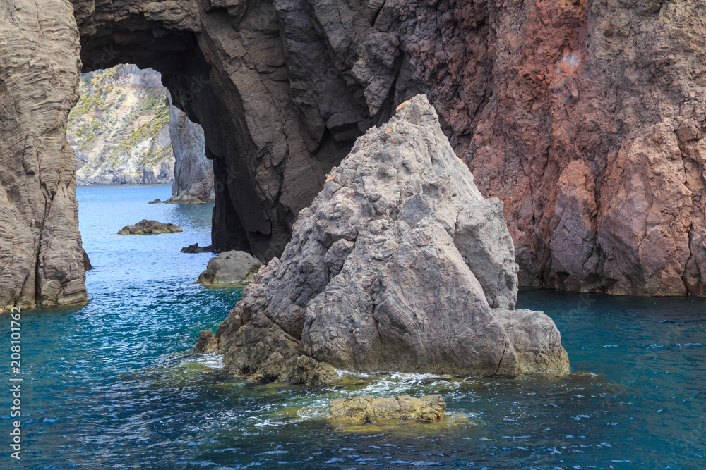 Aeolian Islands in the Tyrrhenian Sea, near Sicily. Rocky, lava-formed picturesque and rough shores of the Lipari island
