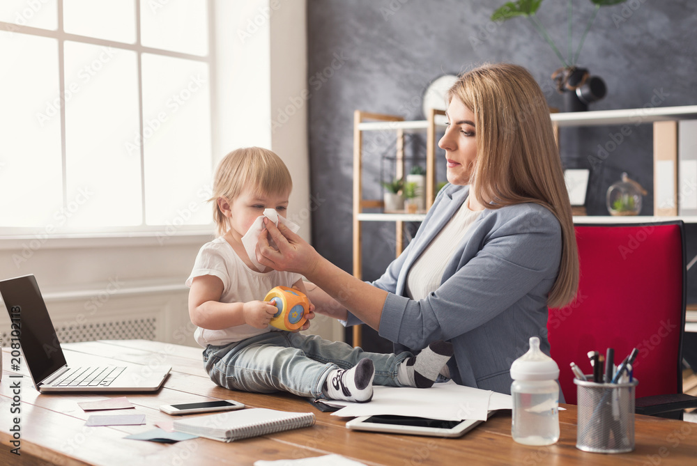 Young mother working and spending time with baby Young mother working and spending time with baby