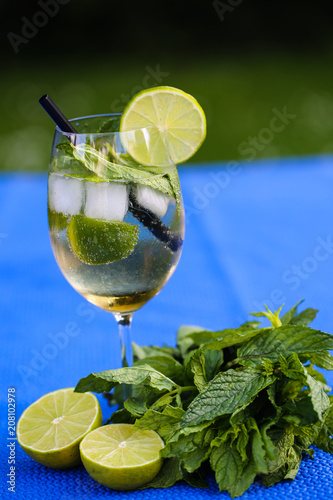 Hugo, summer cocktail on blue background photo