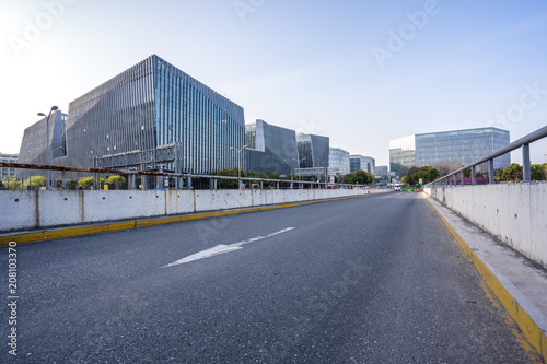 empty asphalt road with modern office building