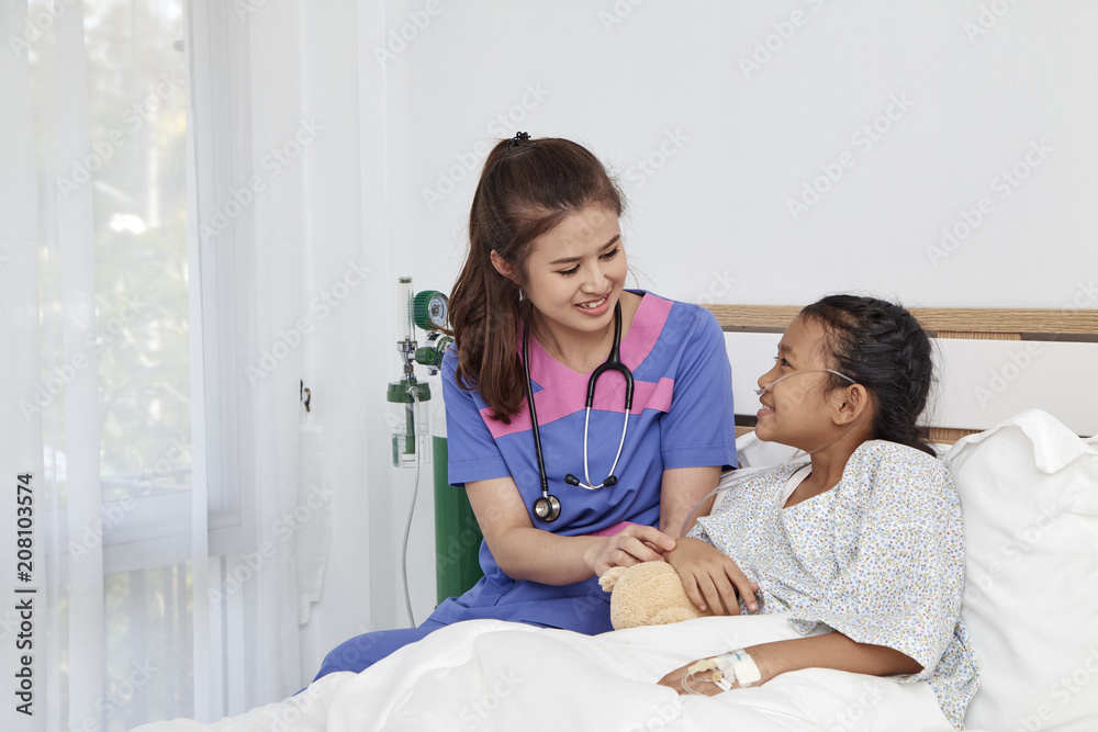 Doctor caring with love little girl in hospital Doctor caring with love little girl in hospital