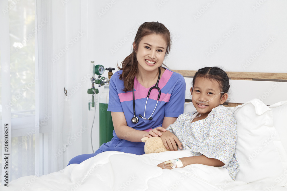 Doctor caring with love little girl in hospital Doctor caring with love little girl in hospital