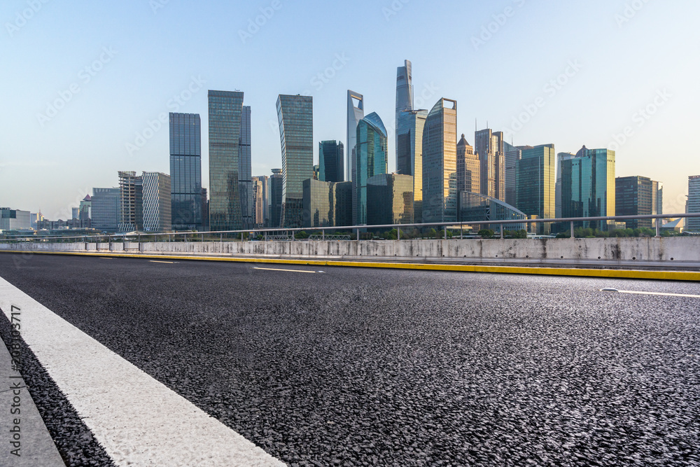 city skyline with asphalt road