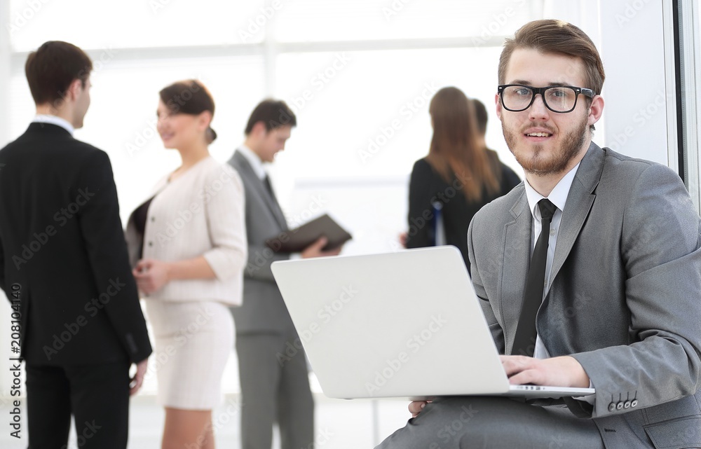 Manager with documents on the background of colleagues Manager with documents on the background of colleagues