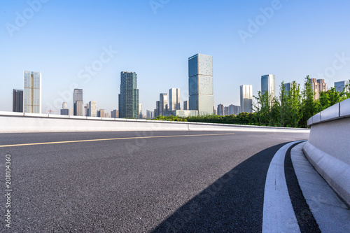 city skyline with asphalt road