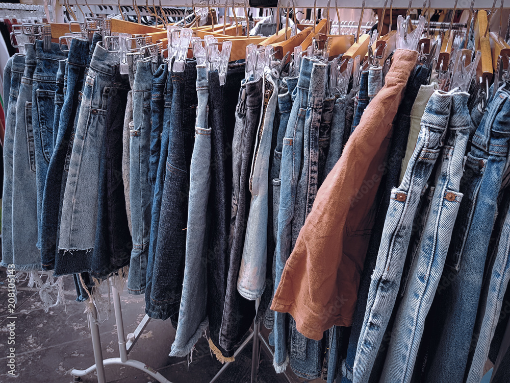 Various Designs of Blue Skirt Jeans Hanging on the Rack