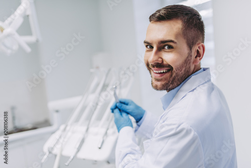 dentist holding dental drill