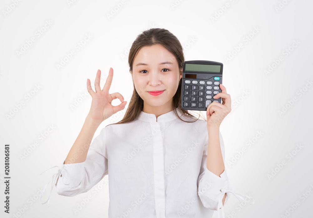 Happy Young Asian woman show OK with calculator Happy Young Asian woman show OK with calculator
