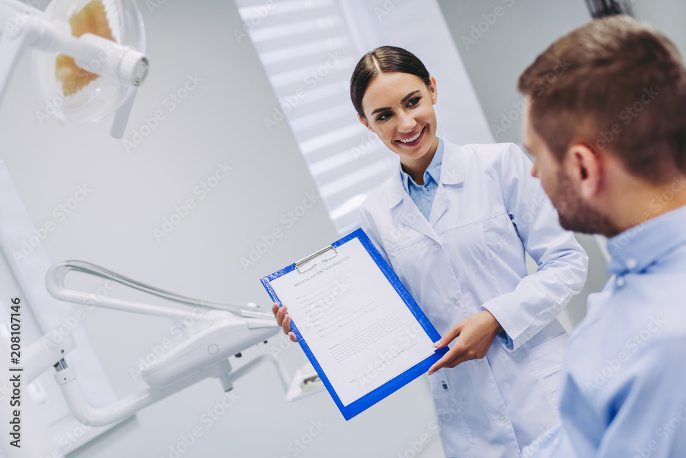 doctor showing dental results to patient doctor showing dental results to patient