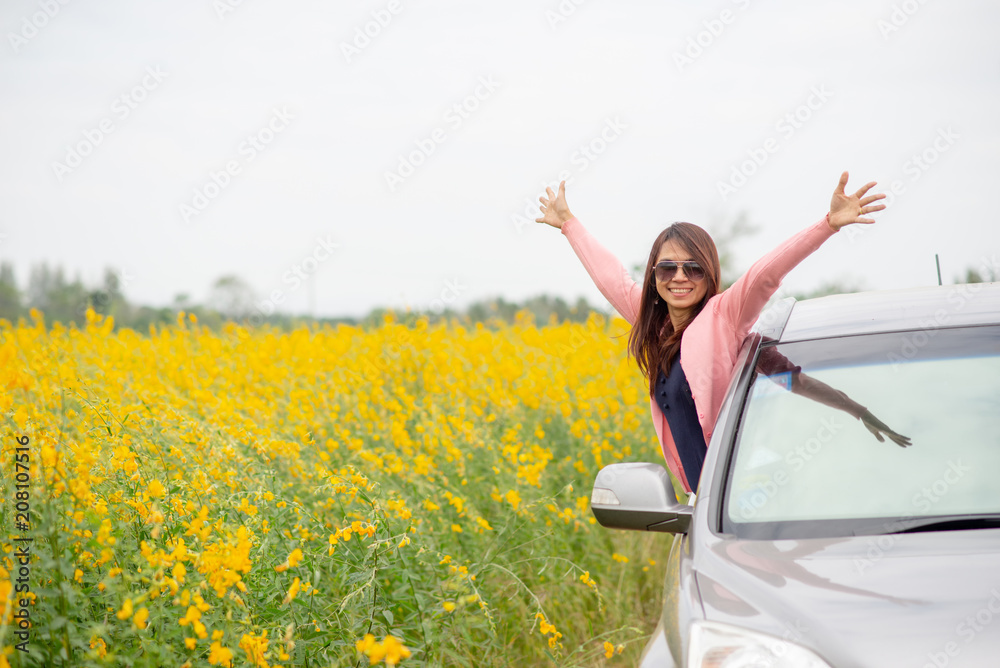Freedom and Holiday Trip Concept,Person view of freedom and traveler asian woman.Happy Holiday Trip and Good life,Lifestyle of Young girl spreading hands with Sunn hemp field background. Freedom and Holiday Trip Concept,Person view of freedom and traveler asian woman.Happy Holiday Trip and Good life,Lifestyle of Young girl spreading hands with Sunn hemp field background.