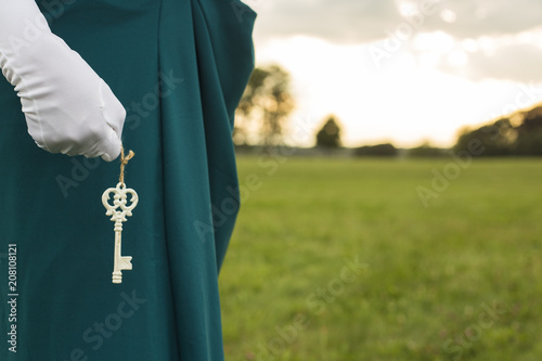 Woman holding key photo