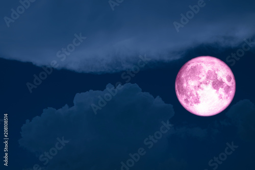 super moon between silhouette heap cloud night sky