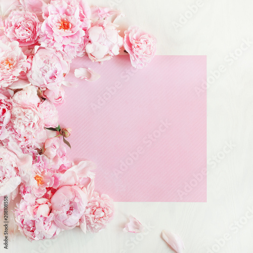 Flat lay concept with beautiful peonies, can be used as background 