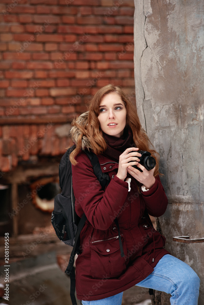 Smiling happy woman with digital camera photographing outdoor Smiling happy woman with digital camera photographing outdoor