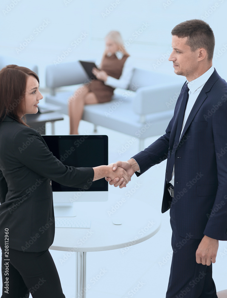handshake business partners at the negotiating table. handshake business partners at the negotiating table.