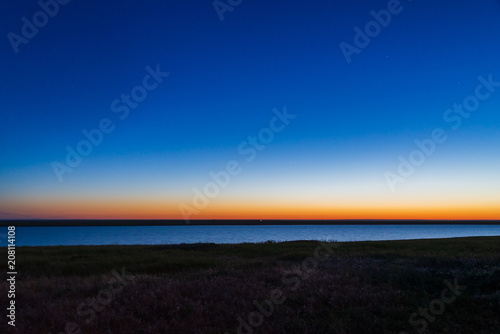 Obraz na płótnie Gradient sunrise sky showing blue, yellow and orange layer w salonie