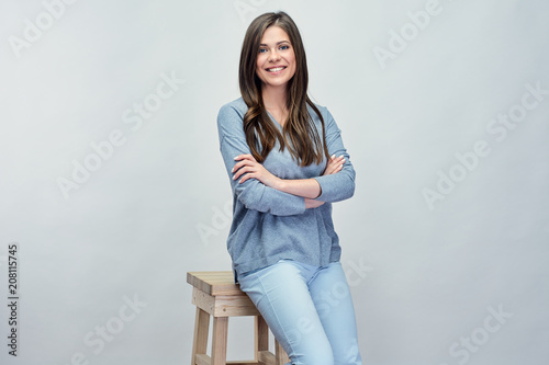 Smiling woman sitting on hi stool. photo